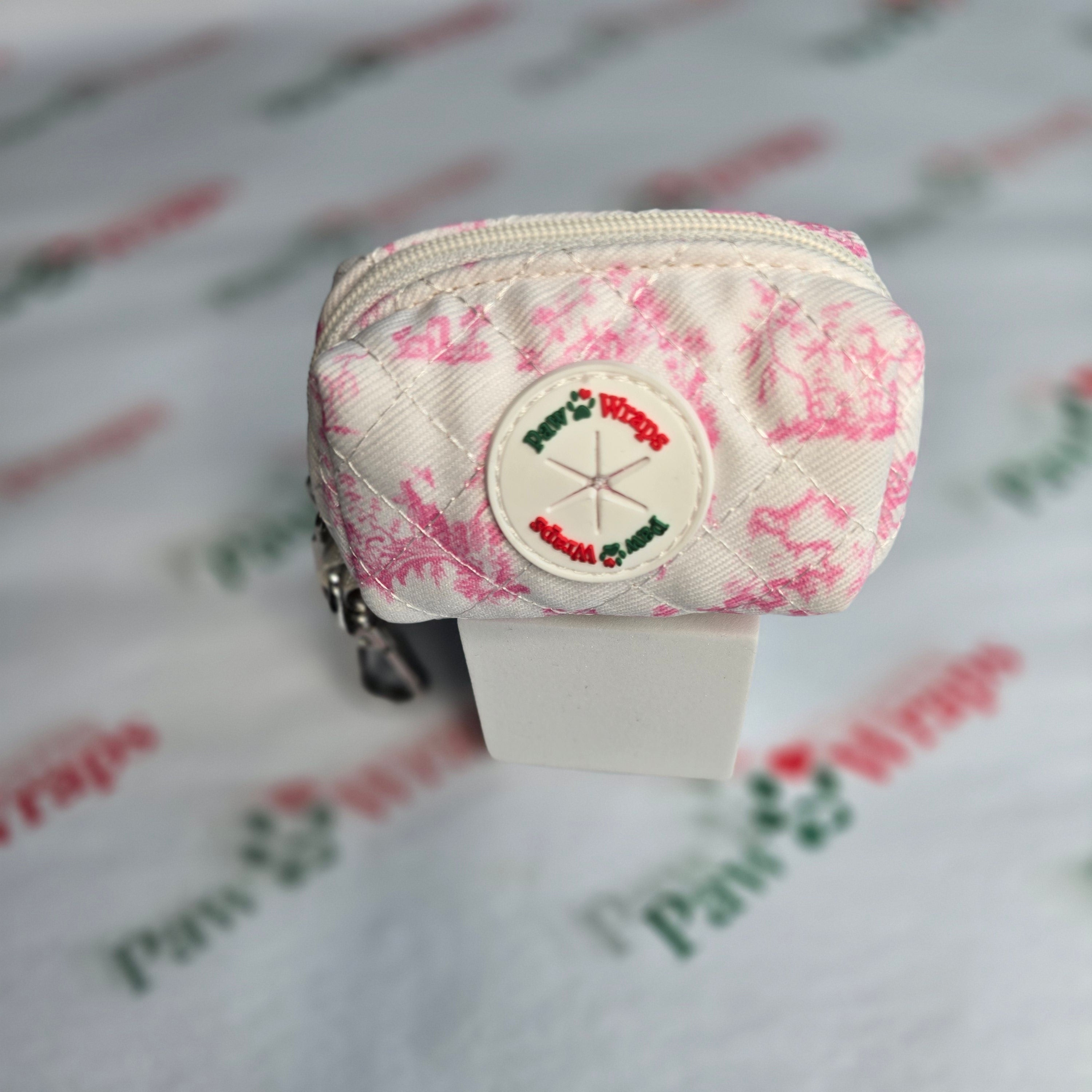 Pink floral quilted dog walking bag with Paw Wraps logo, stylish accessory for small dogs