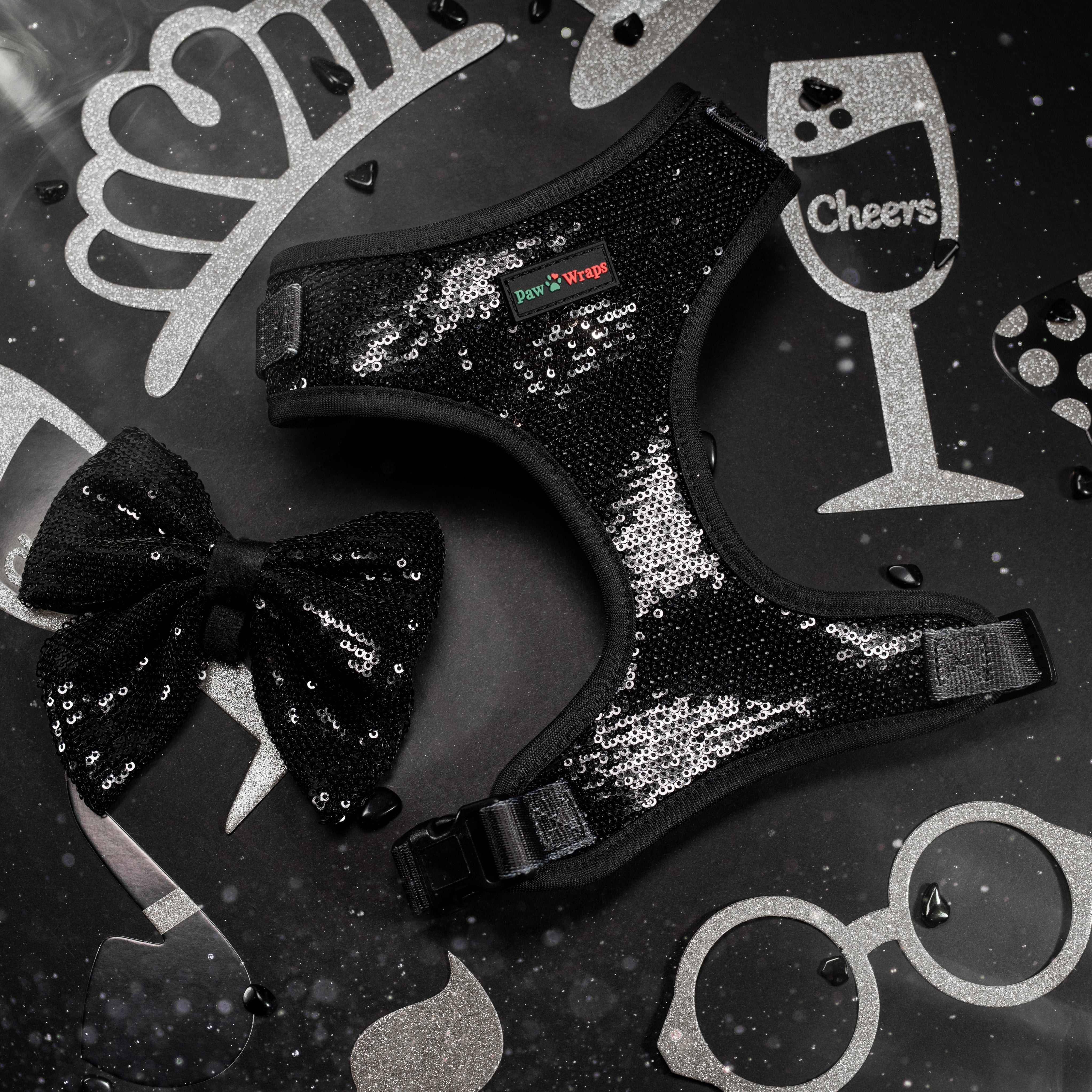 Black sequin dog harness and bow tie with festive party props for stylish pups
