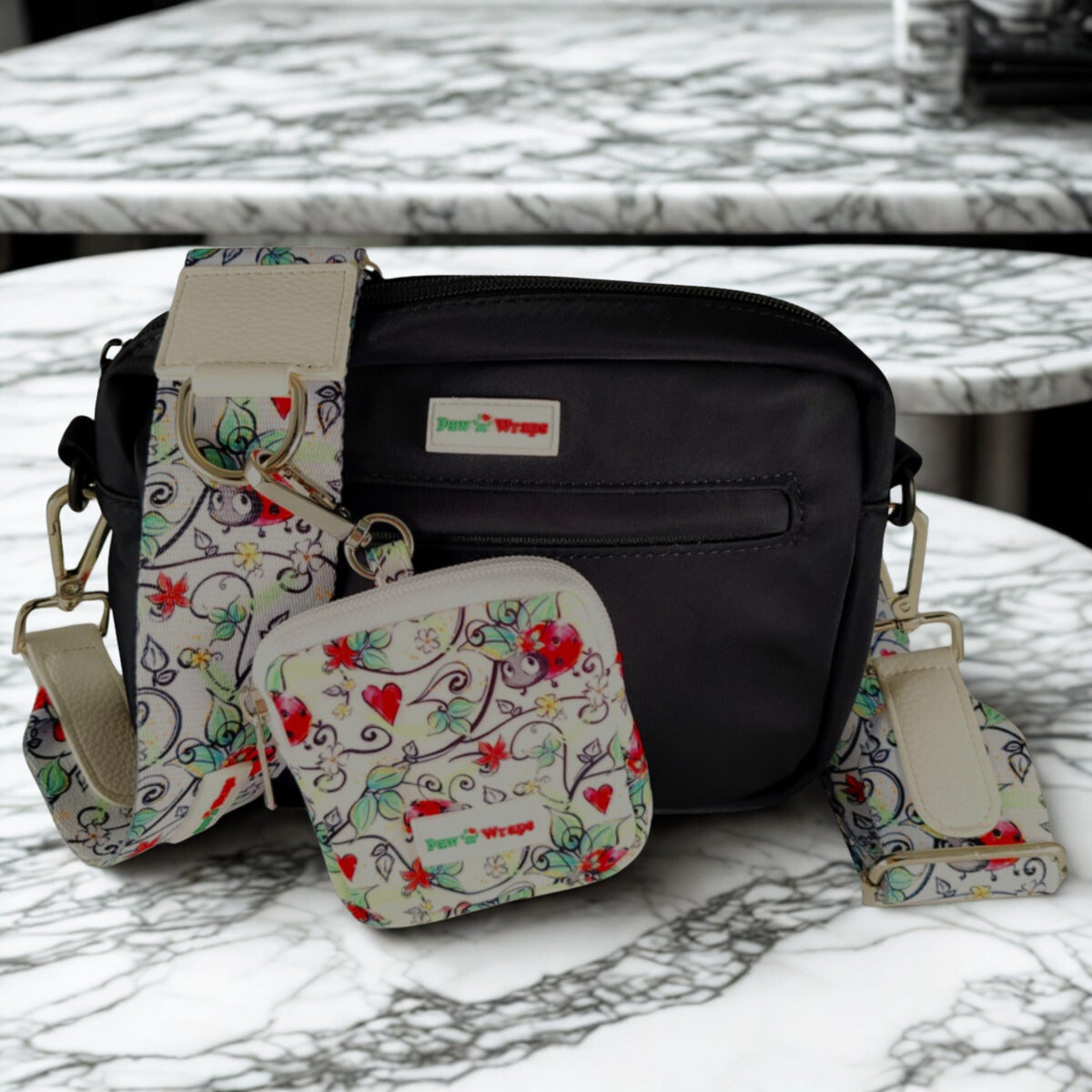 Stylish dog walking bag with floral ladybug print, matching pouch & adjustable strap for small dogs