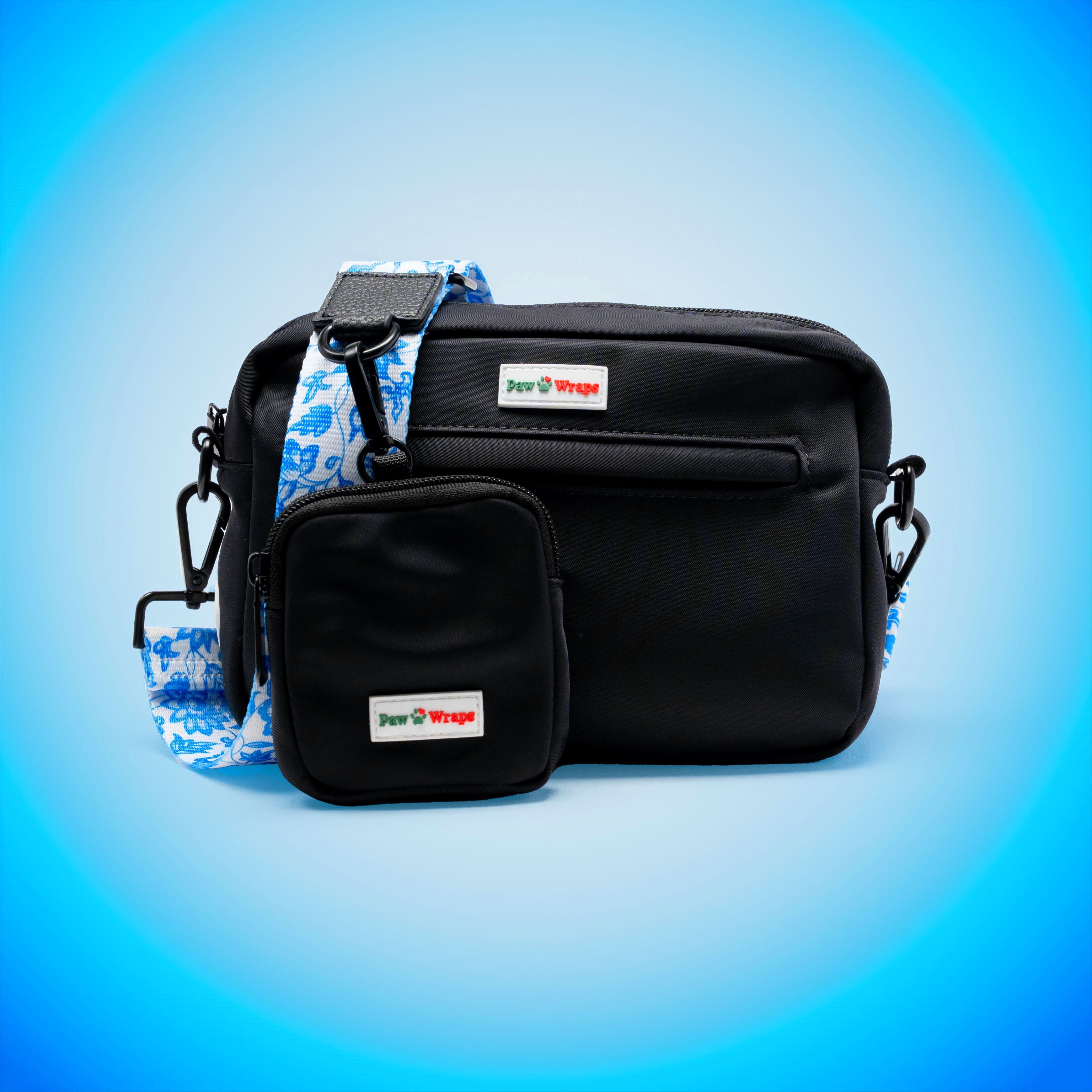 Black dog walking bag with blue floral strap, stylish and functional for small dogs