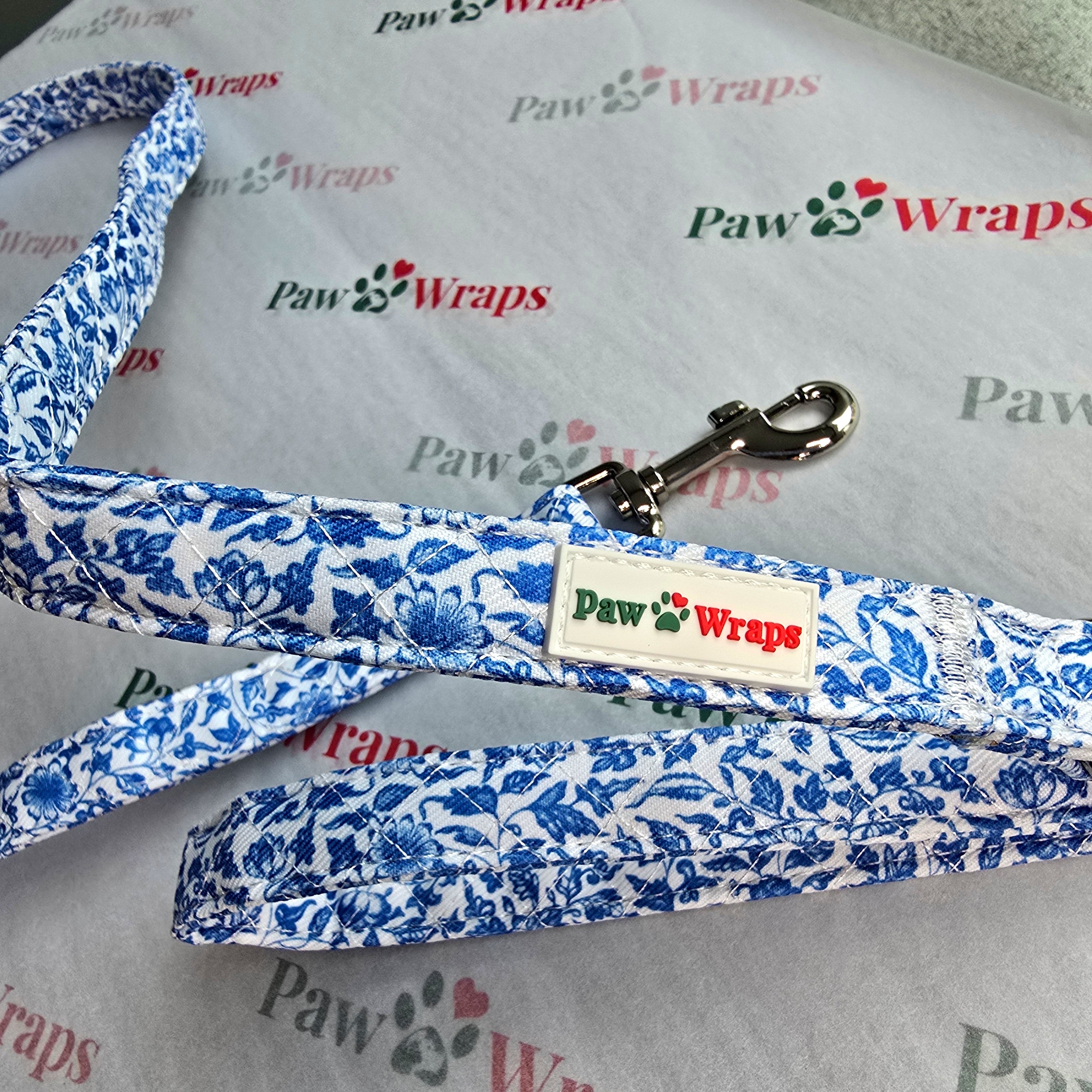 Blue floral dog leash with Paw Wraps branding, stylish and comfy for small dogs