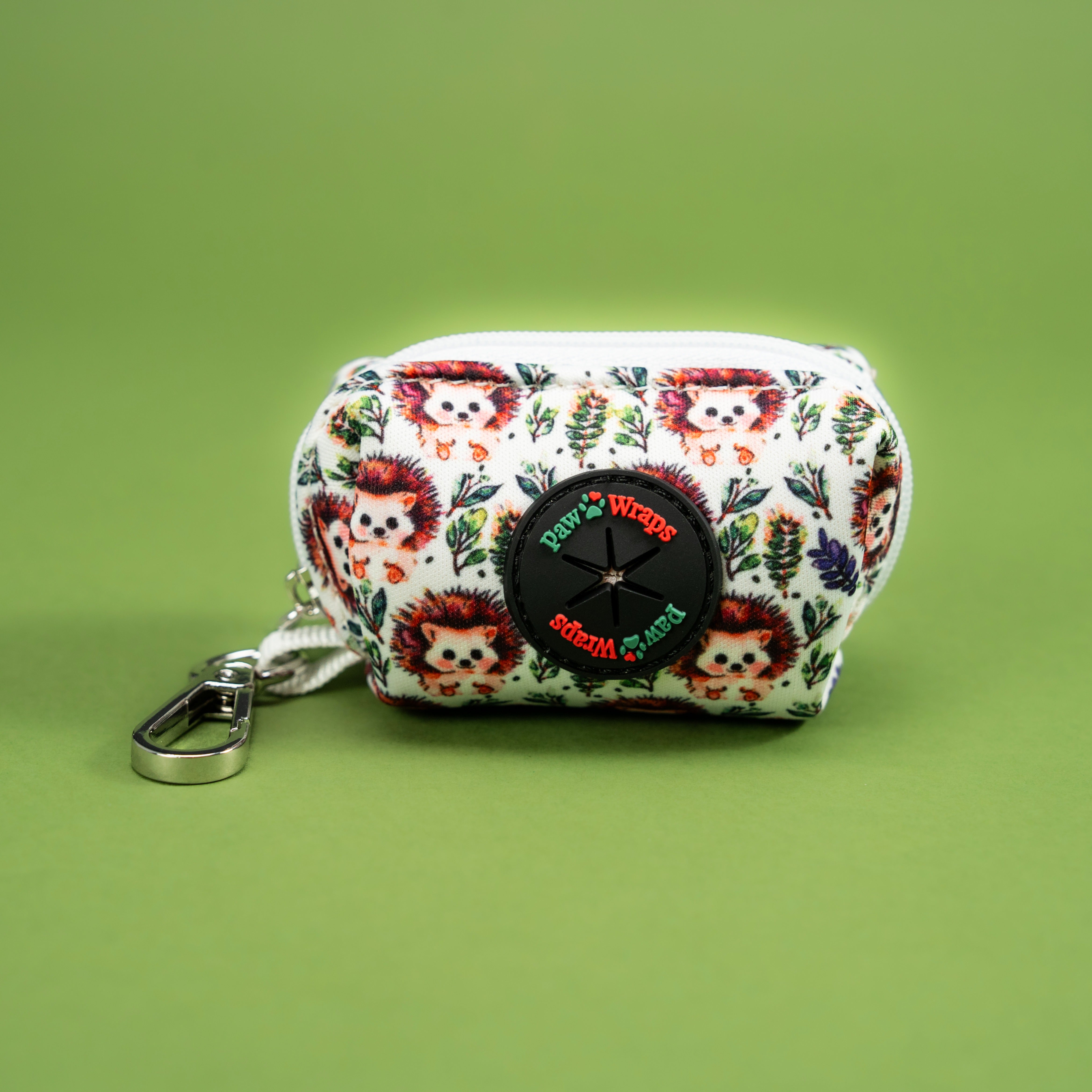Cute hedgehog print dog accessory pouch with Paw Wraps logo, perfect for stylish walks.