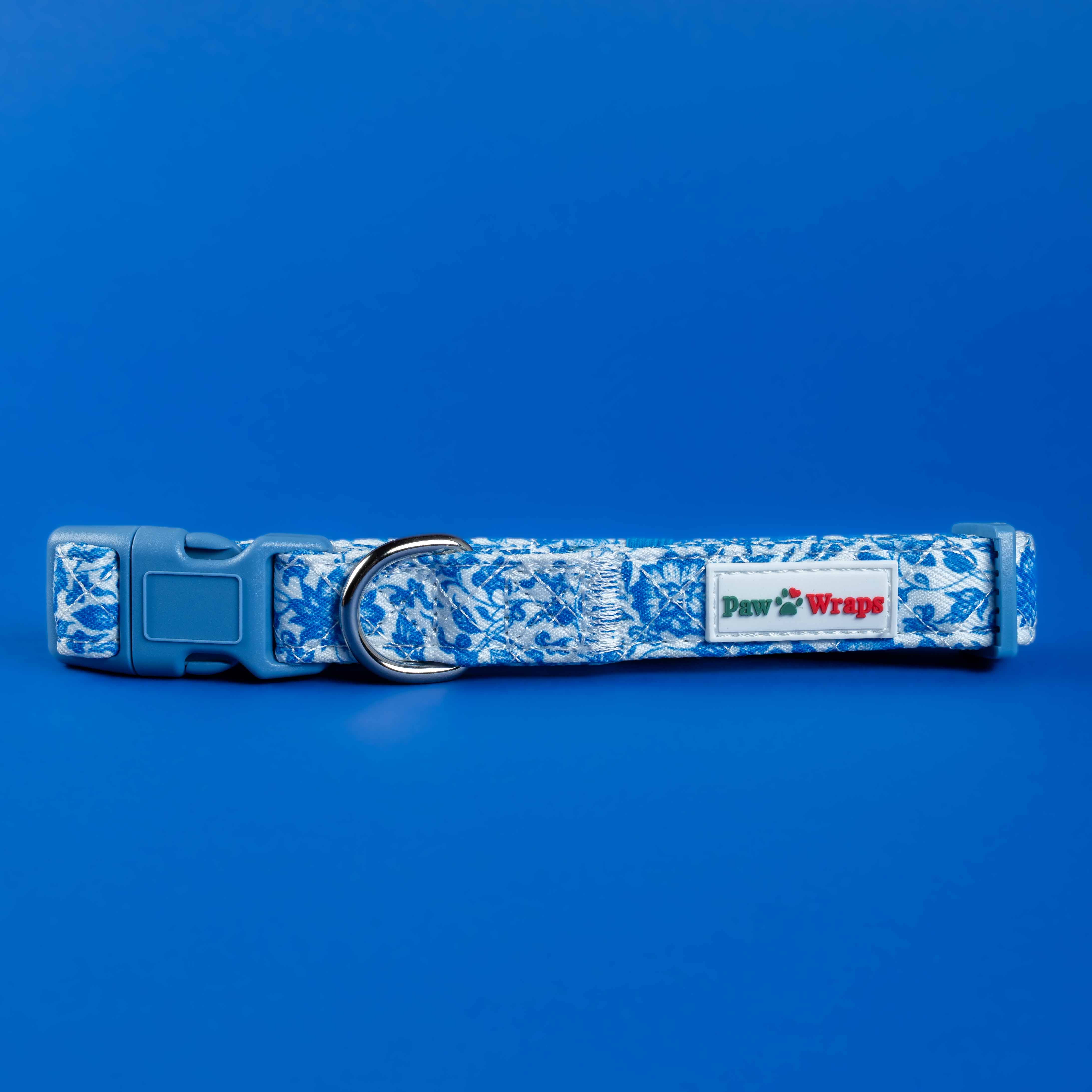 Blue floral dog collar with Paw Wraps label, stylish pet accessory for small dogs