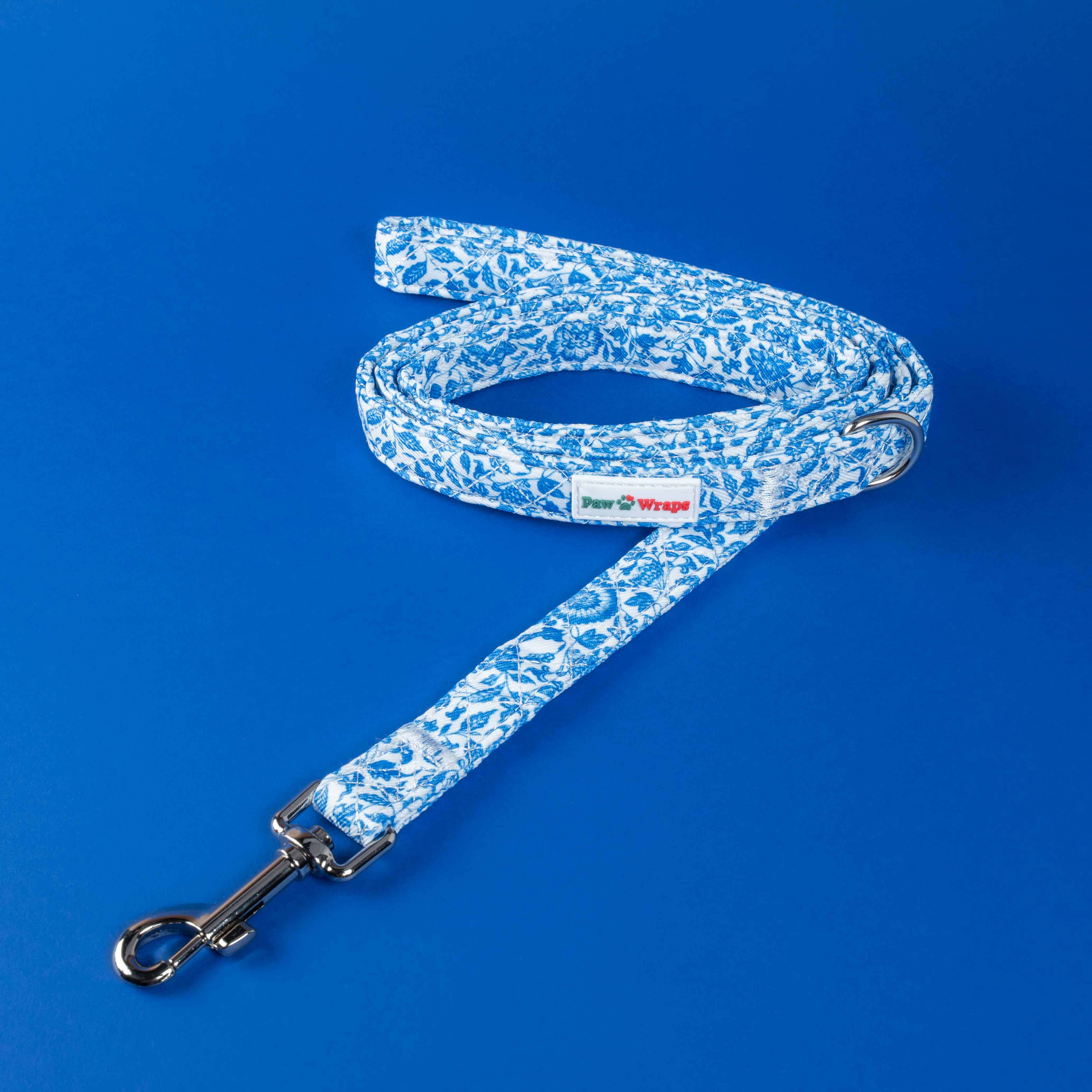 Blue floral dog leash with Paw Wraps label, stylish accessory for small dogs