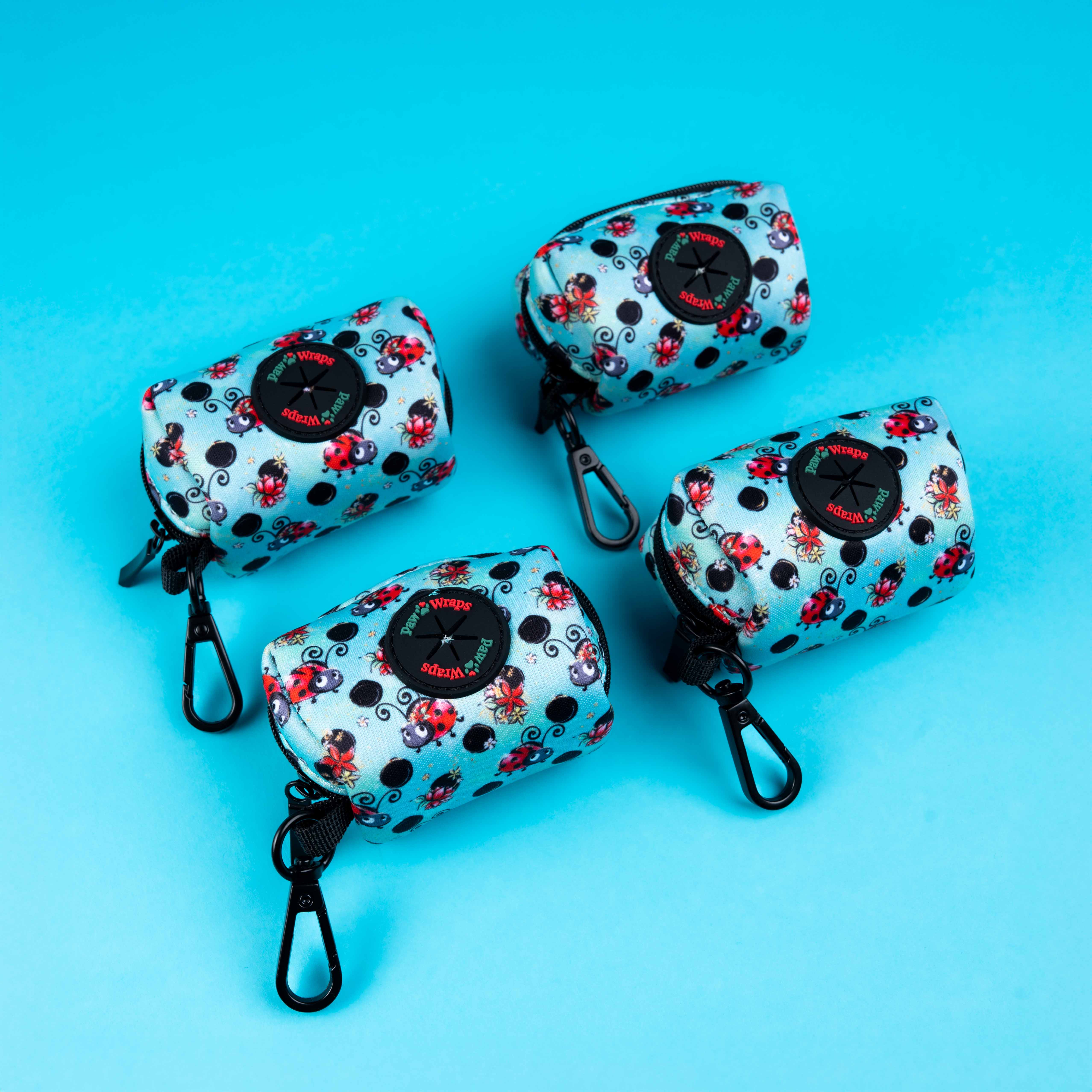 Cute ladybug print dog waste bag dispensers with carabiner clips, perfect for stylish puppy walks.