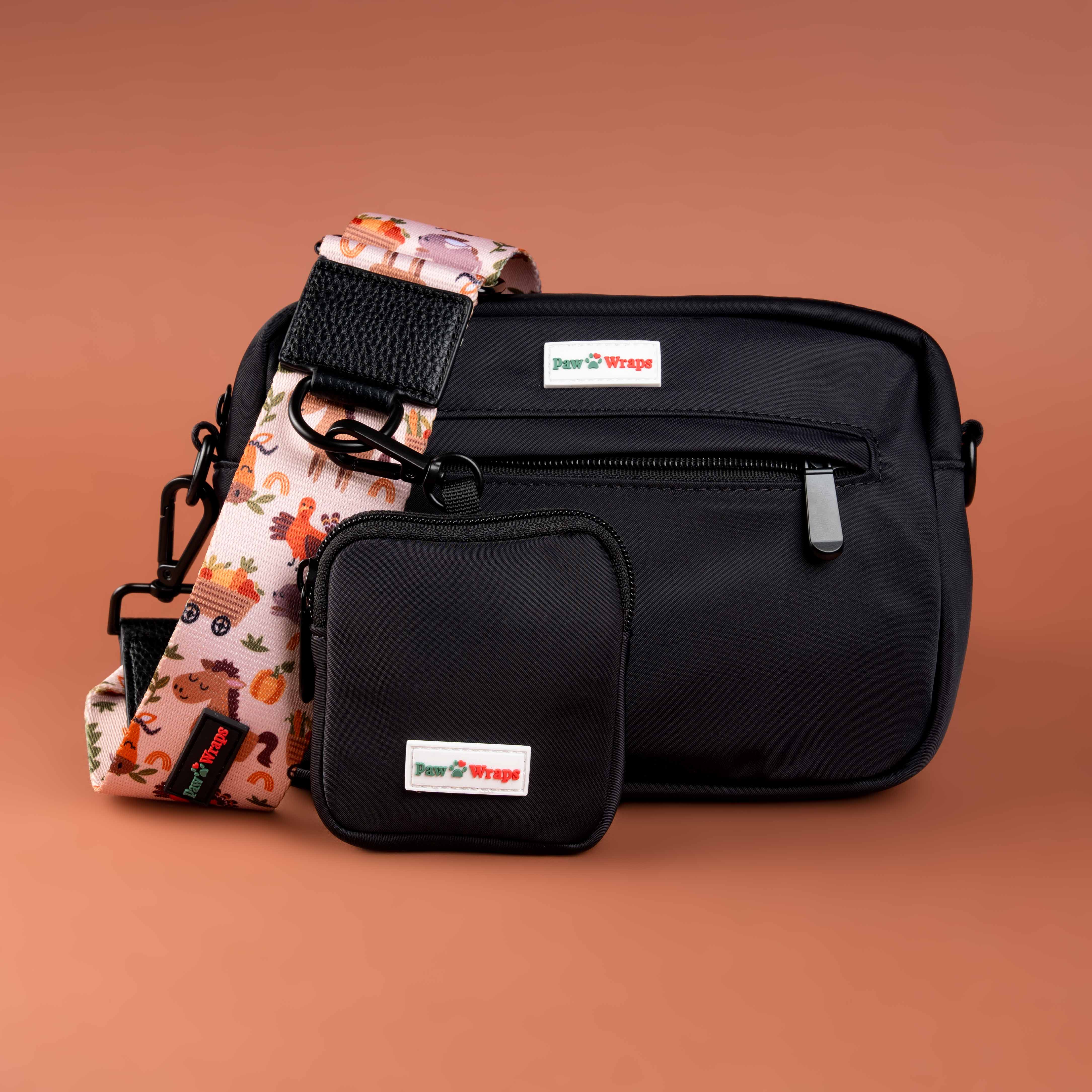 Stylish black dog walking bag with colorful strap, perfect for luxury small dog accessories and pup attire.