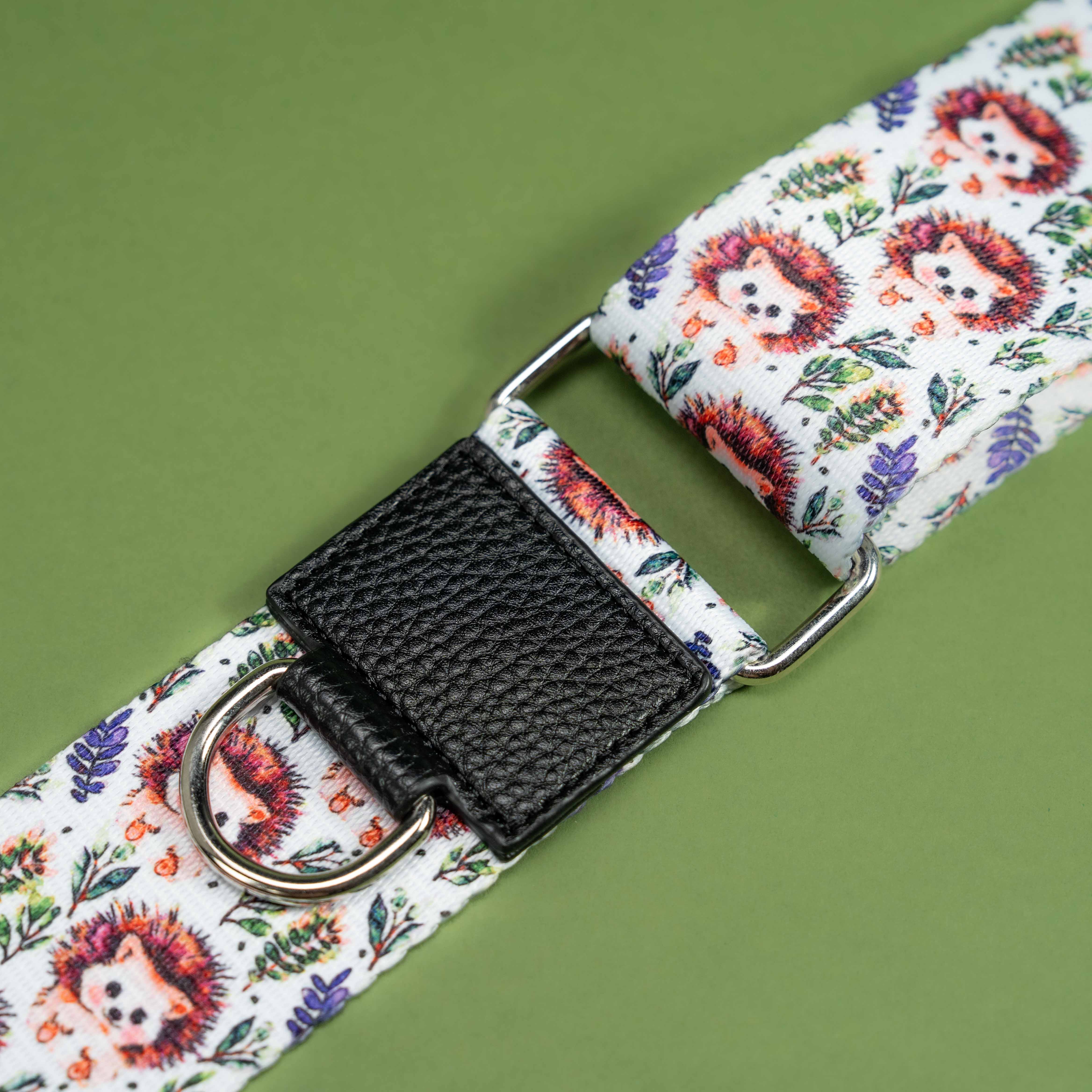 Cute hedgehog print dog lead with black textured buckle on green background