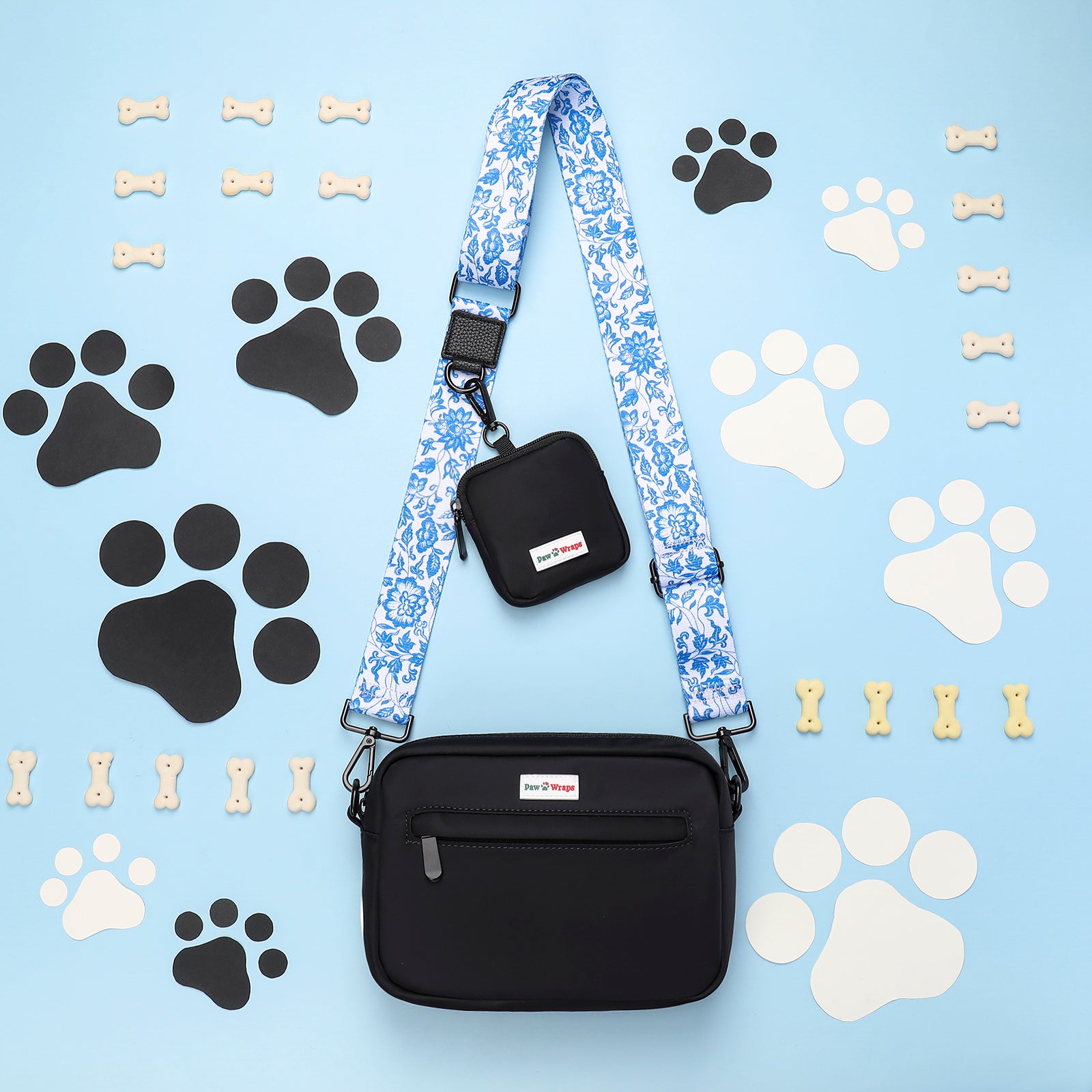 Stylish dog walking bag with floral strap, paw prints & bones. Perfect for luxury small dog accessories.