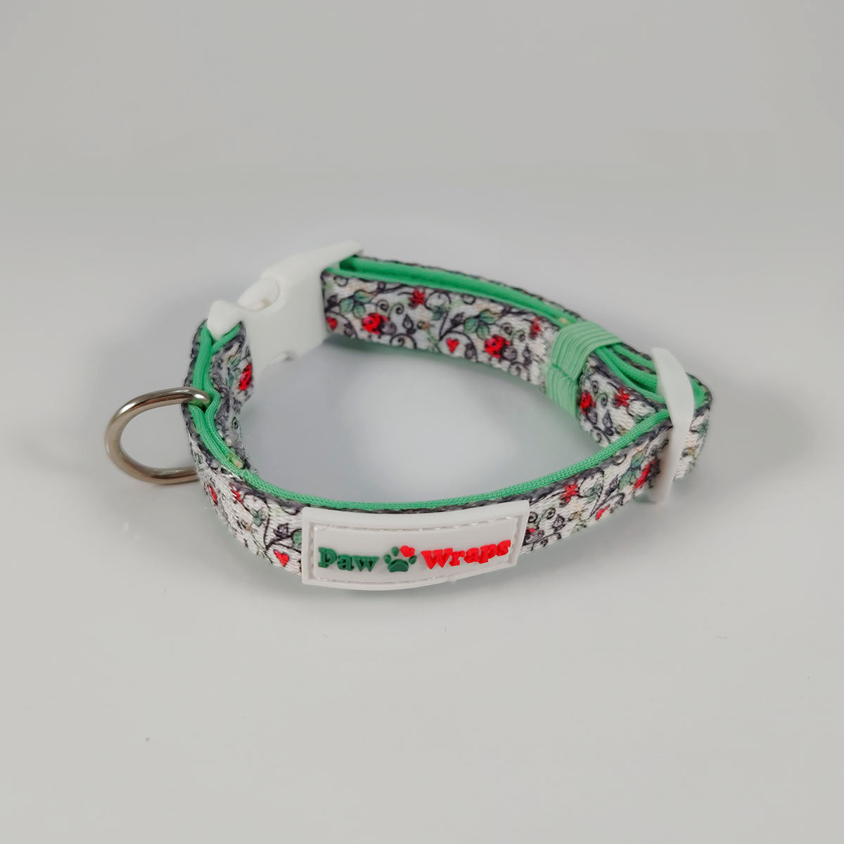 Floral pattern dog collar with green trim and Paw Wraps branding, stylish accessory for small dogs
