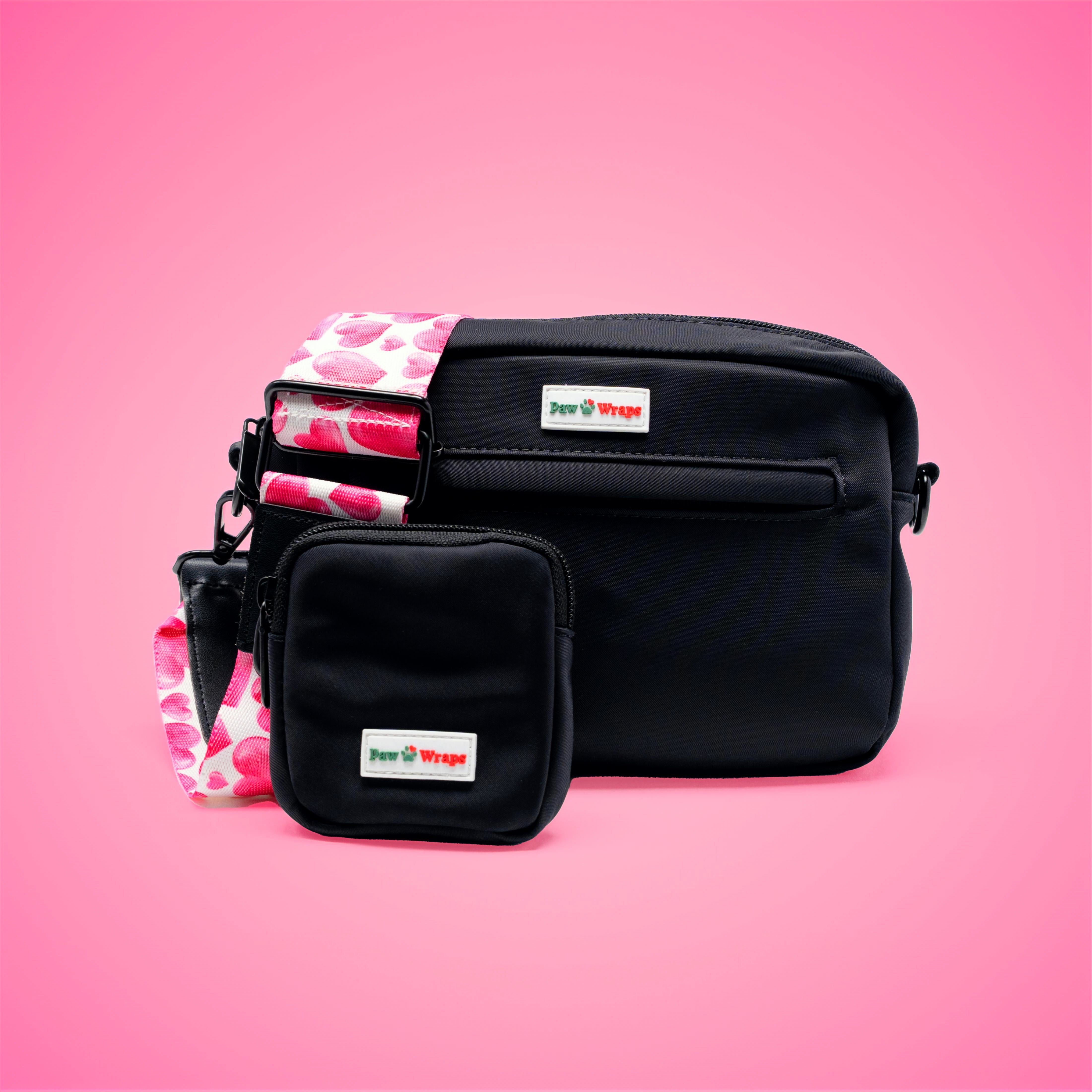 Black dog walking bag with pink heart strap, stylish and functional for small dogs