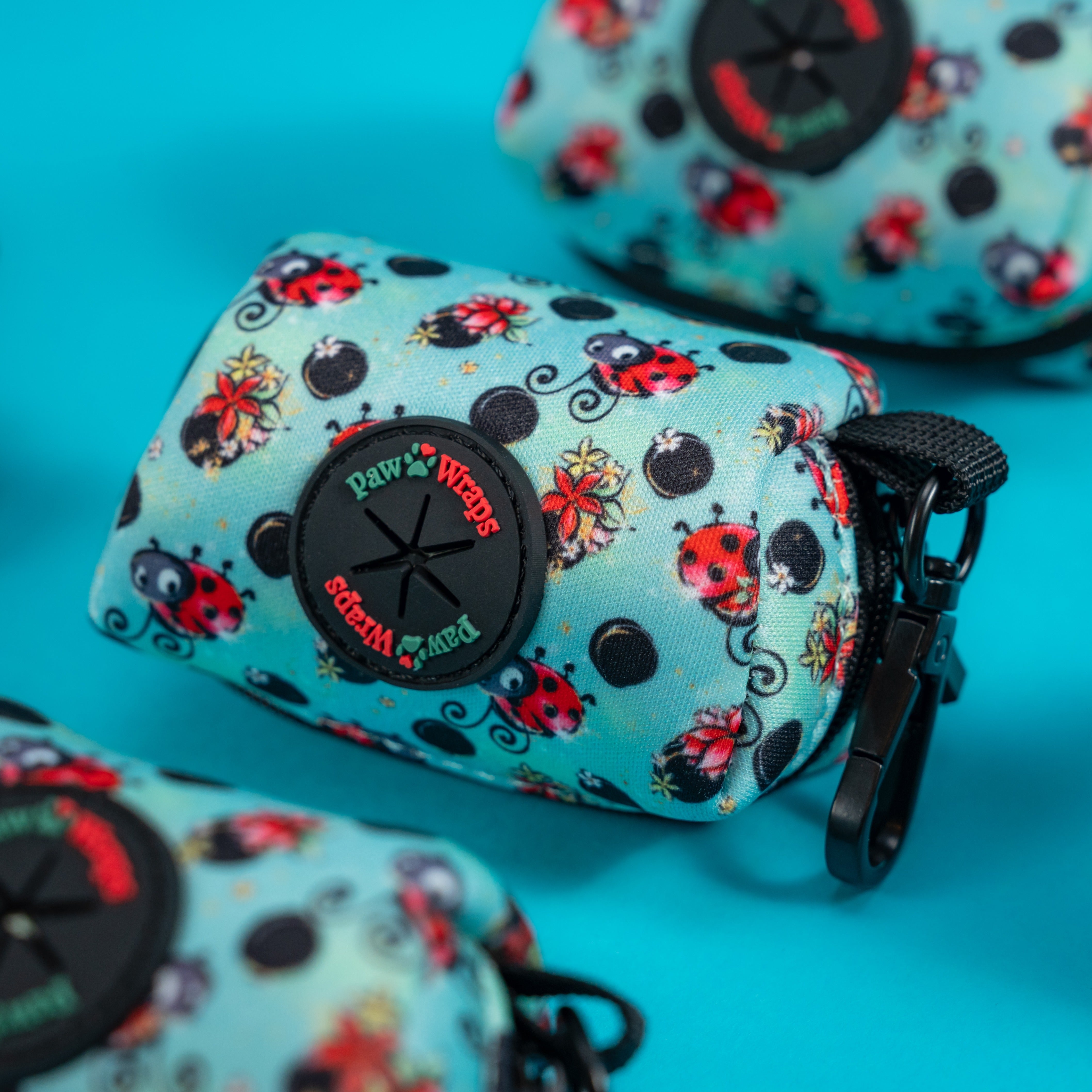 Ladybug print dog waste bag dispenser with black clip, perfect for stylish walks