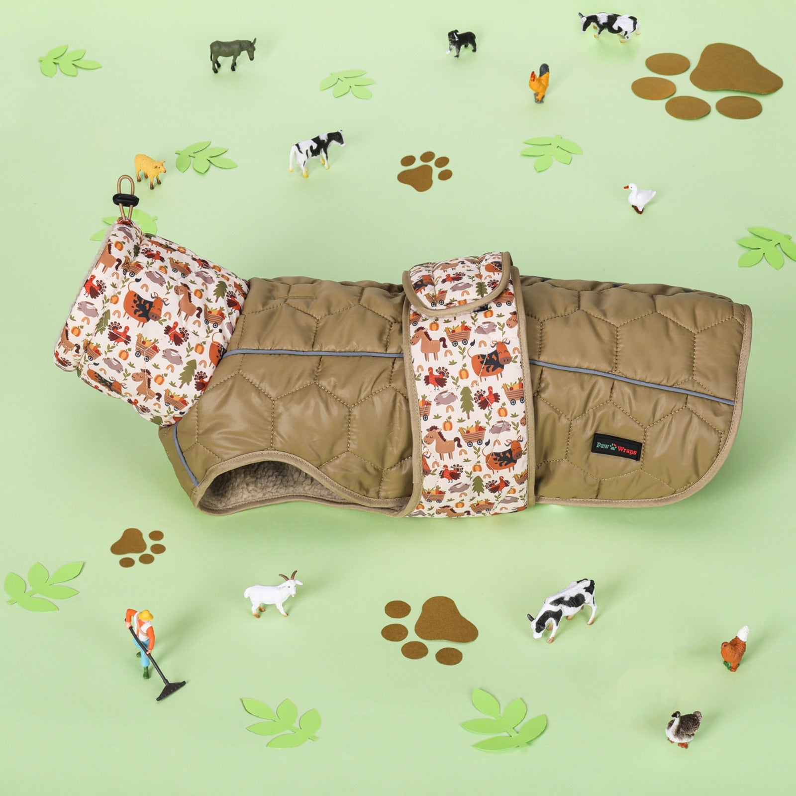 Stylish quilted dog coat with farm animal print, perfect for cozy walks and seasonal adventures.