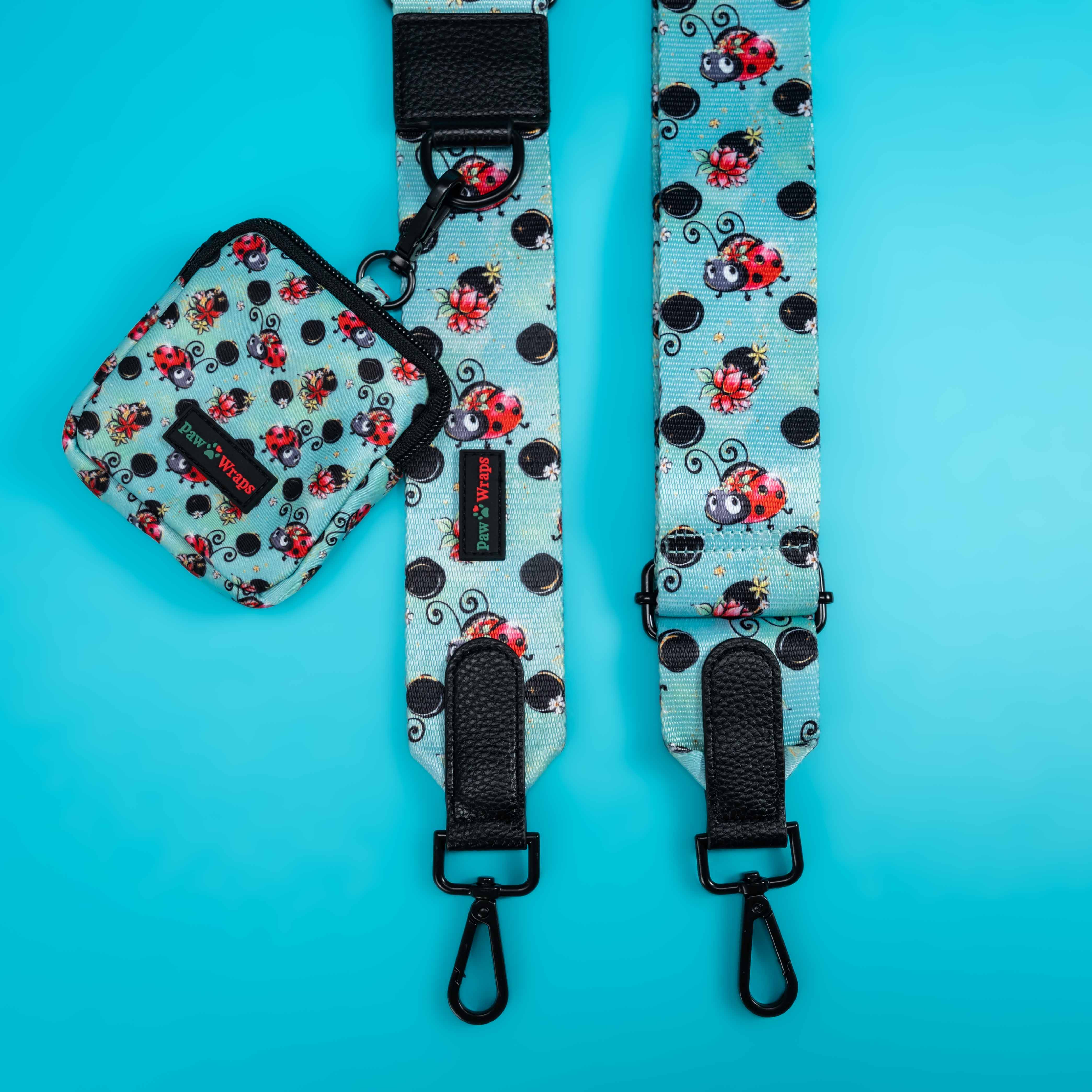 Ladybug print dog walking bag and matching leash set with black hardware on teal background